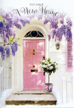 The photograph presents a front step that feels quintessentially Putney: charming, softly coloured, and framed by nature. A pastel pink door stands at the centre, its tone muted and sophisticated, like the blush of evening sky over the Thames. The door is set into a whitewashed wall, which carries a faint texture and reflects the daylight, giving the entrance a bright but gentle appearance. A matching pink shutter to the side adds balance, suggesting open windows and an easy, welcoming lifestyle. Cascading above is an exuberant sweep of wisteria, its hanging clusters of lavender and light purple blooms forming a natural arch. The flowers trail down in loose, fragrant strands that appear almost like a curtain you could brush aside as you step forward. At the very threshold, a grey tin bucket rests securely on the stone step, sturdy yet quietly decorative. From it rises a full bouquet of white and cream roses, their petals silky and numerous, some blossoms in full bloom and others still promising to open. Delicate sprigs of green foliage are interspersed among the roses, bringing a sense of freshness and a slightly wild, garden-inspired character, as though sourced from one of Putney's hidden courtyards. Encircling the bucket is a pale pink ribbon, tied into a neat bow whose flowing ends echo the softness of the wisteria tendrils above. Light filters through the blossoms and across the doorway, creating gentle patterns and casting the whole scene in a warm, hopeful glow. It feels like a moment just before a first key turns in the lock - a floral tribute to the joy, nervous excitement, and promise of a new home in Putney.